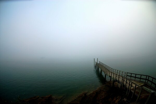 Foggy morning, sea pier