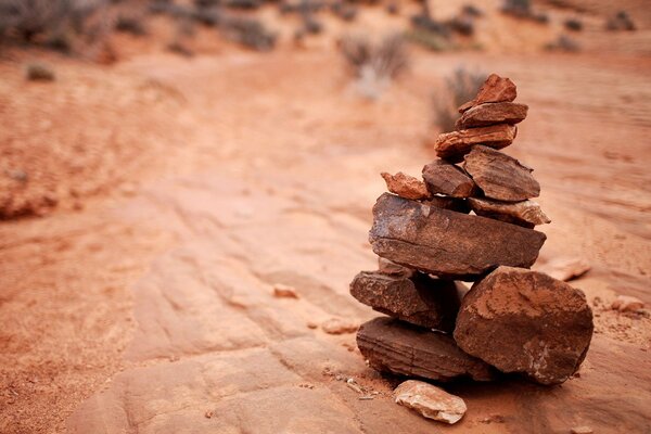 A pyramid of stones on a stone floor