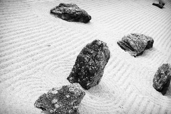 Black and white photo of rocks and sand