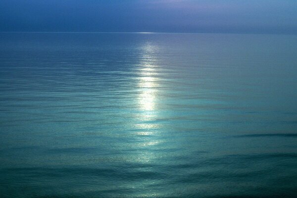 The horizon of the blue expanse of water