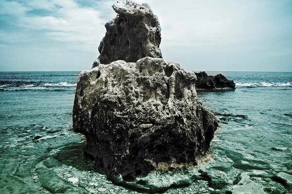 Landscape. Stone in the azure Sea