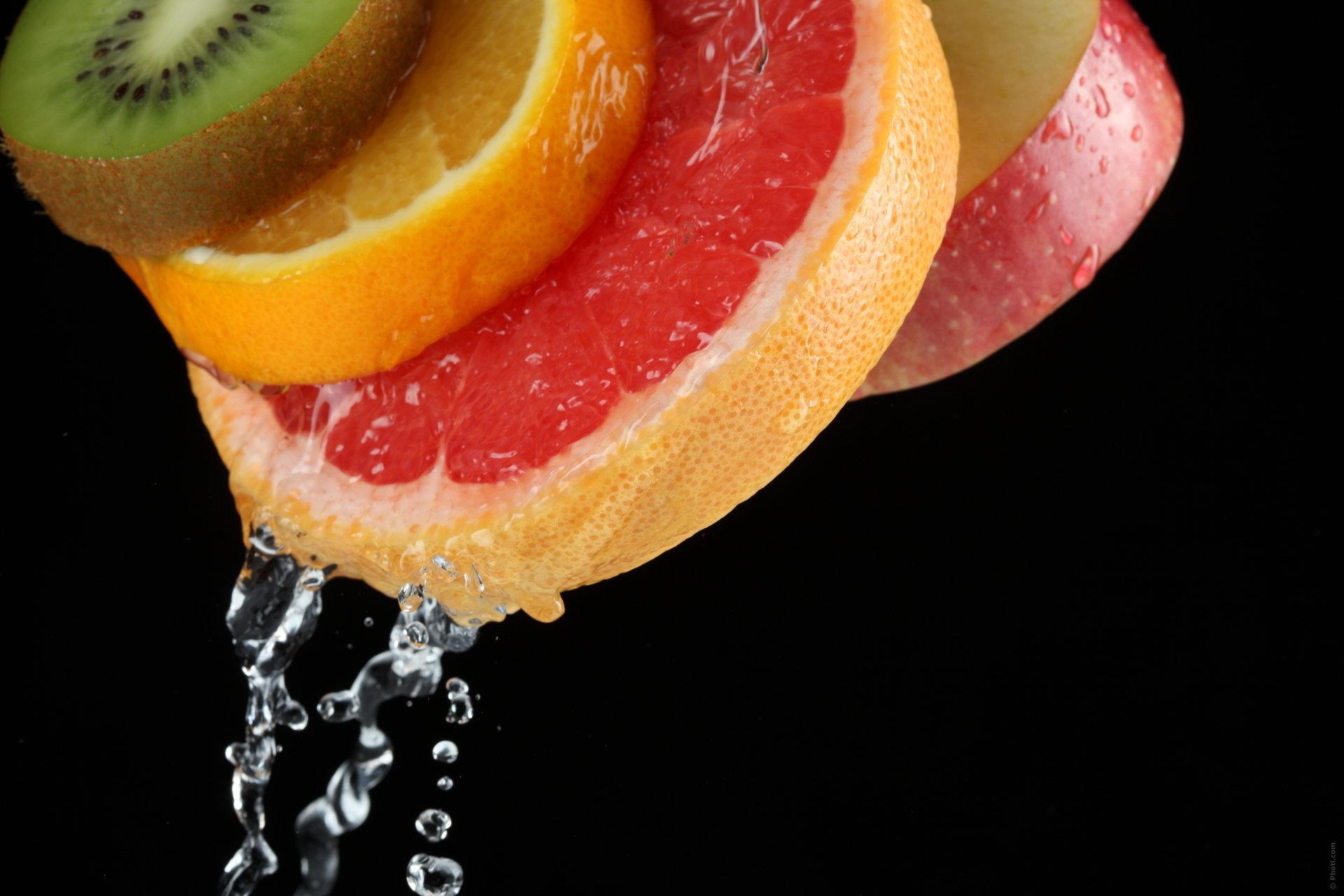 fruits apple kiwi orange water drops close up