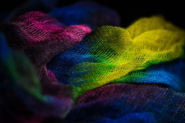 Macro multicolored fabric dark background