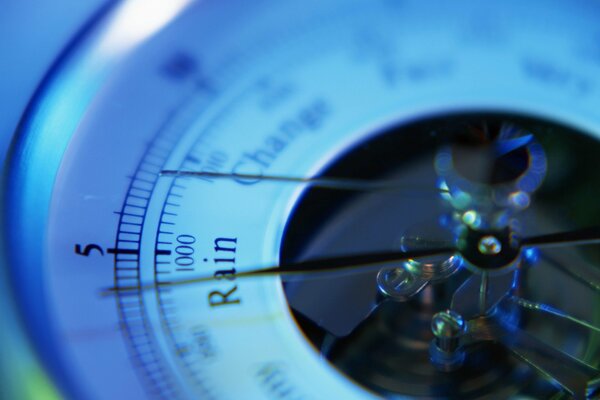 The arrow of the barometer shows rain