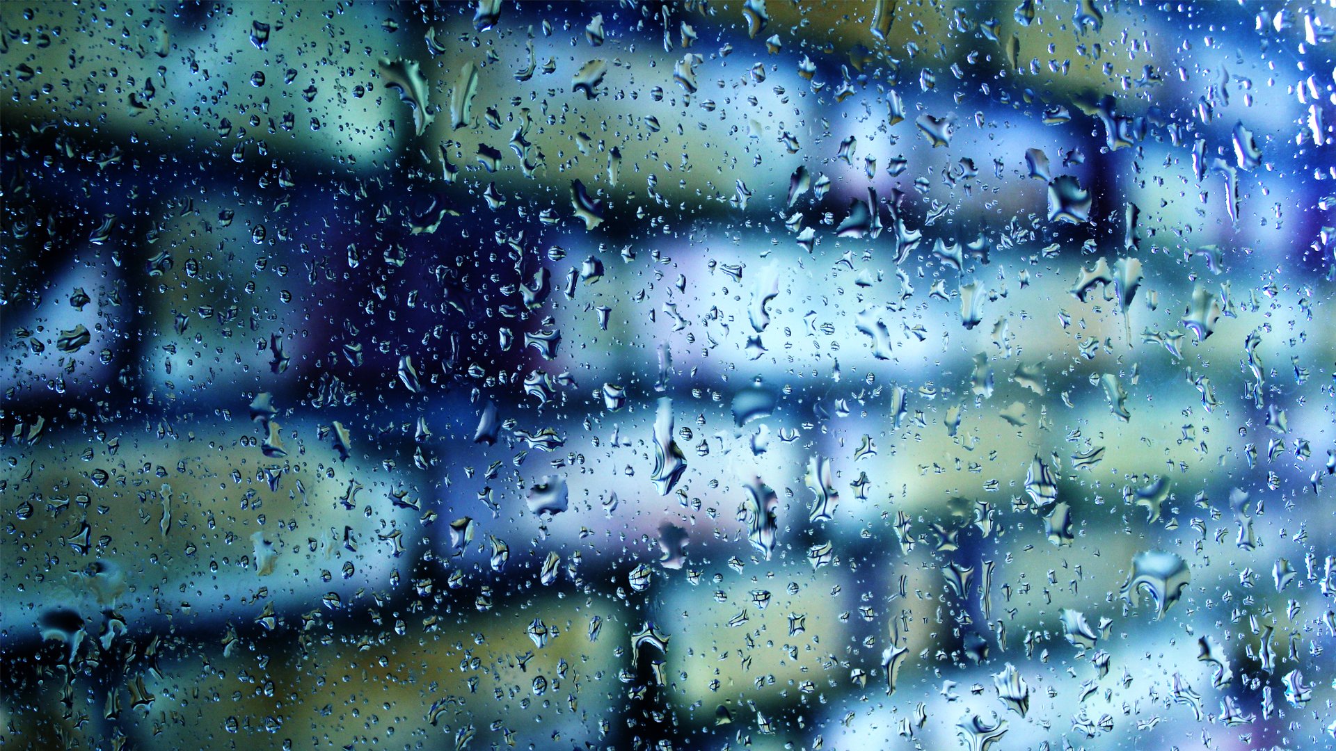 close up glass drops wall brick blur