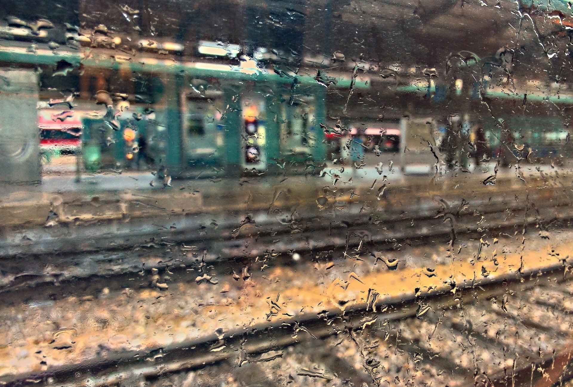 close up wet glass drops railway station