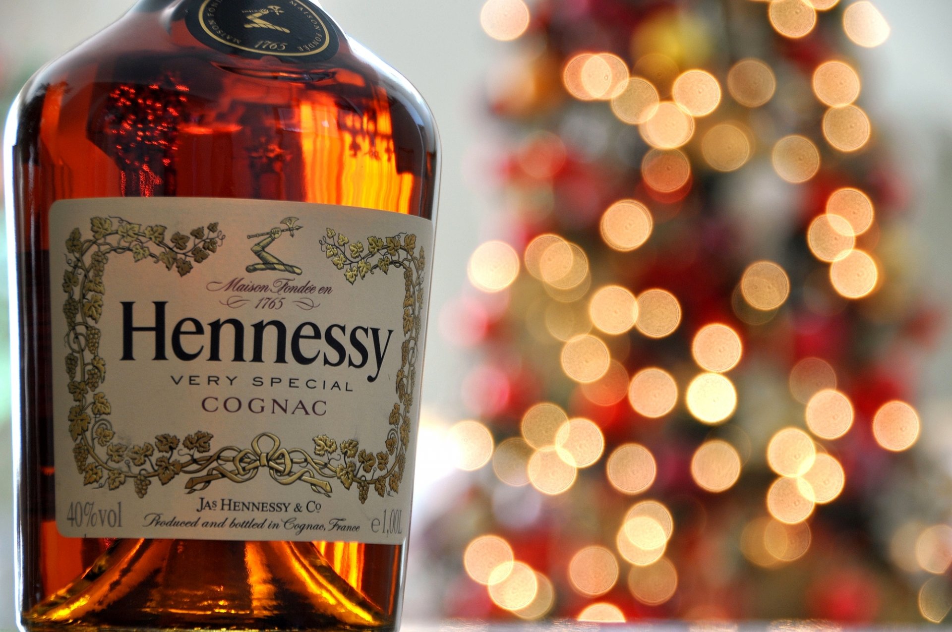 hennessy coñac botella etiqueta bokeh luces