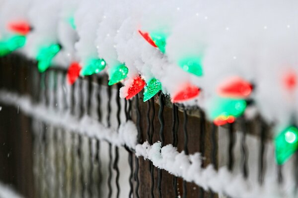 Fence decoration with a multicolored garland