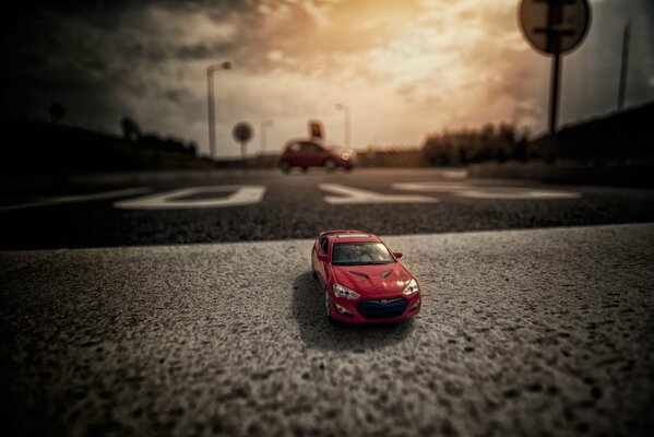 A sporty red car on the road