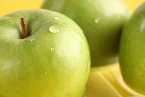 Drops of water on green apples