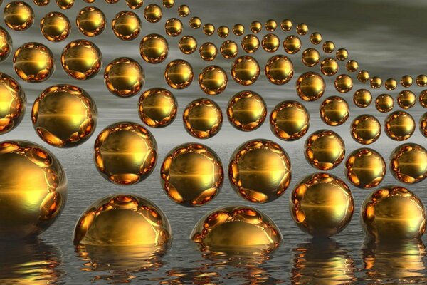 Bolas de oro ondas agua reflexión