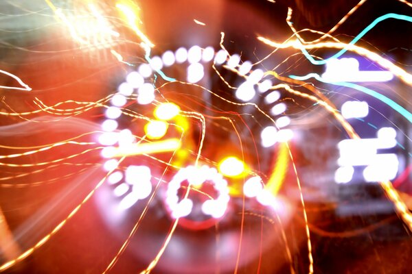 The light is bright the speedometer is white red reflections blur