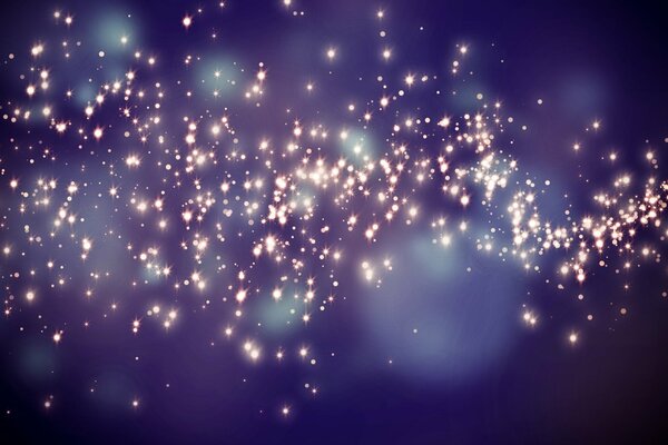 Étoiles avec des reflets sur fond bleu