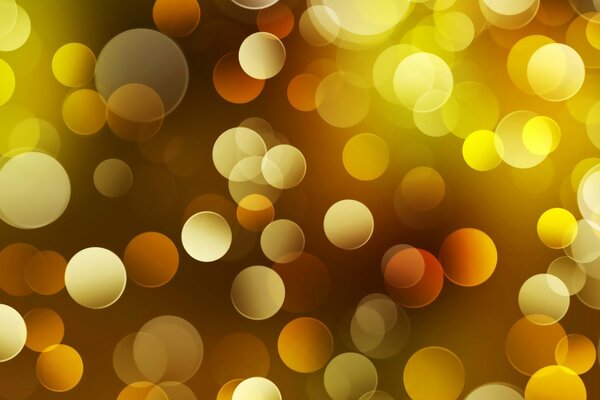 Glare circles reflections of different intensity of colors yellow and orange