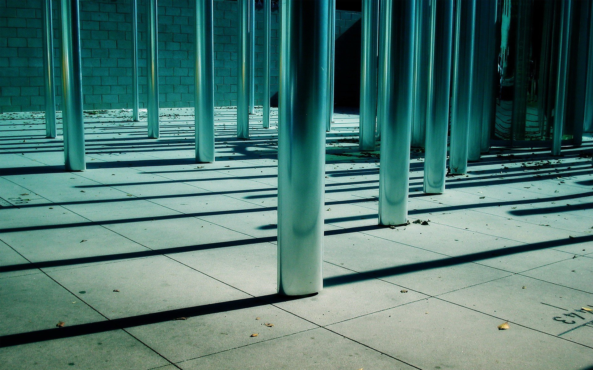 pillars shadow leaves metal