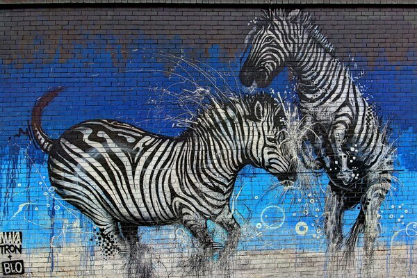 Graffiti giocando zebre sul muro