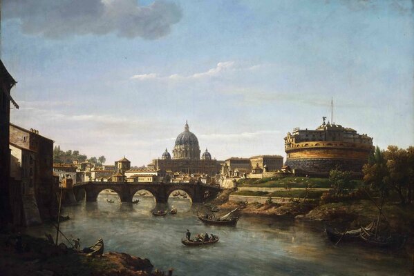 A picture of a part of the city with a bridge over a river on which people are sailing on boats