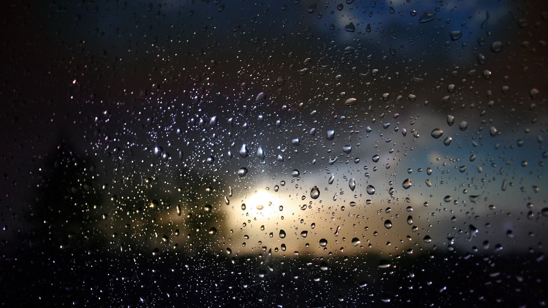 close up glass drops spray water blur light reflection