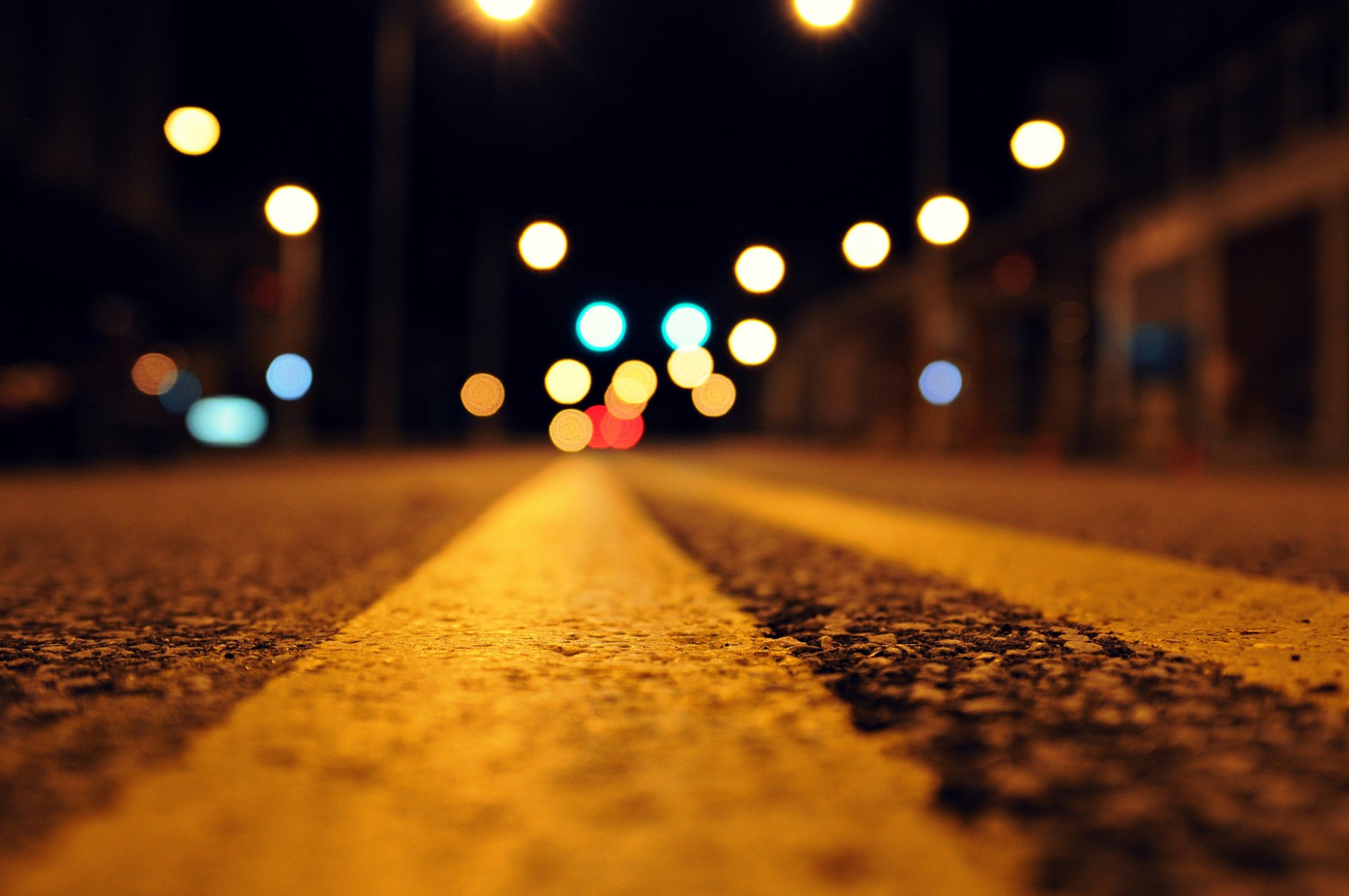 night road asphalt lights bokeh close up