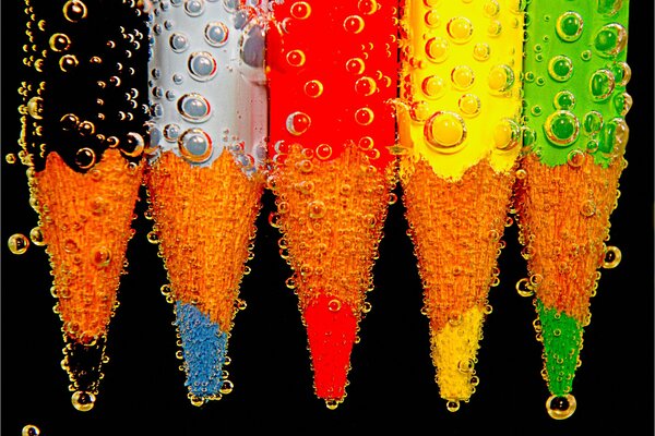 Air bubbles on a pencil in water