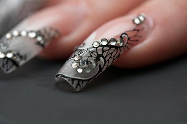 Beautiful manicure on long nails with rhinestones