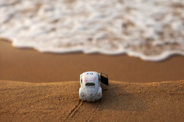 A car on a cliff by the vast sea