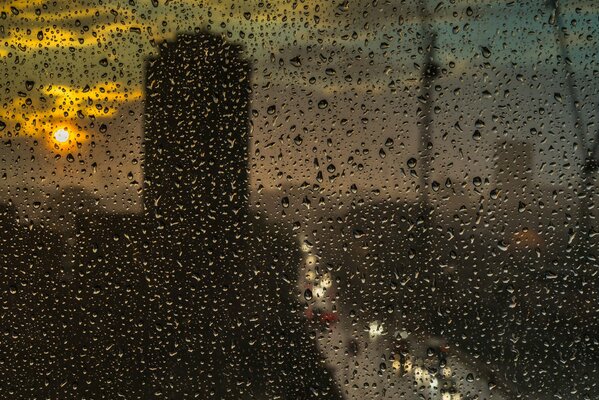 Sunset on a rainy day through glass