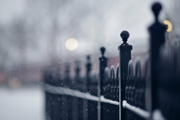 Winter fence on the bridge