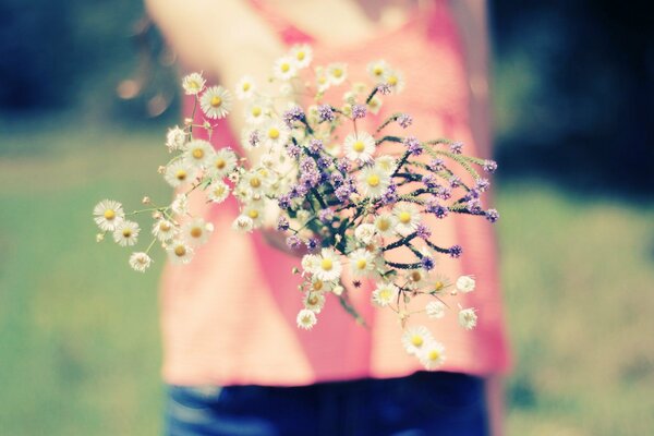 . Girl with flowers in nature