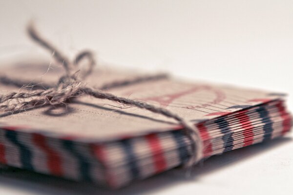 Photo of a stack of letters tied with a whip