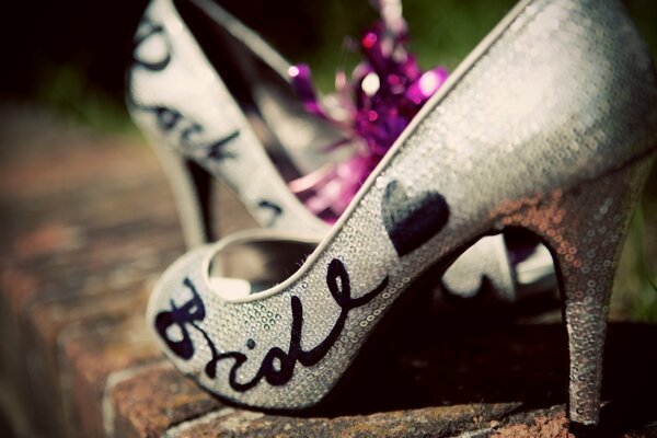 Shoes for the bride in white sequins