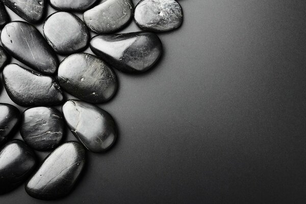 Black stones on frosted glass