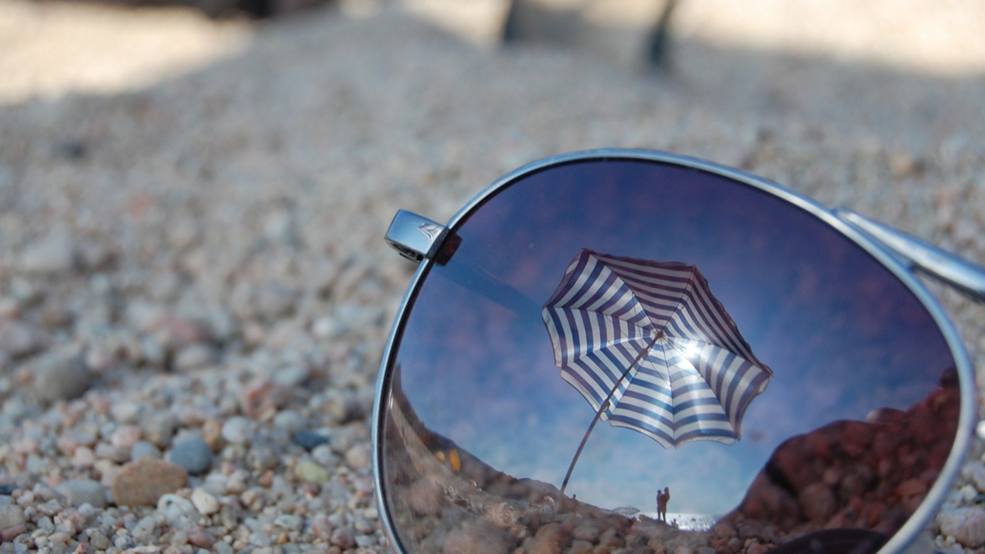 gafas reflexión vidrio macro playa paraguas