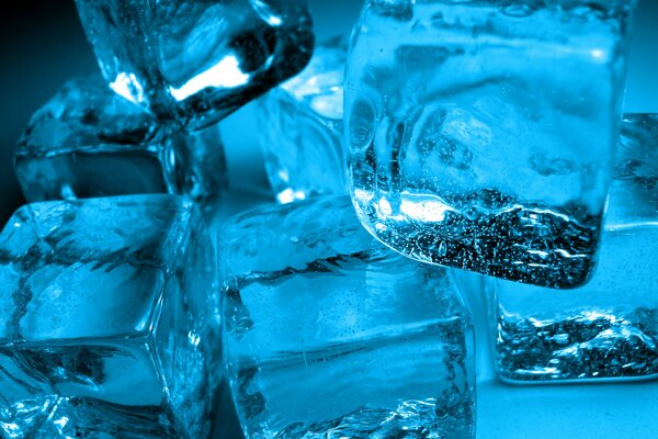 Cold, pieces of ice in blue light