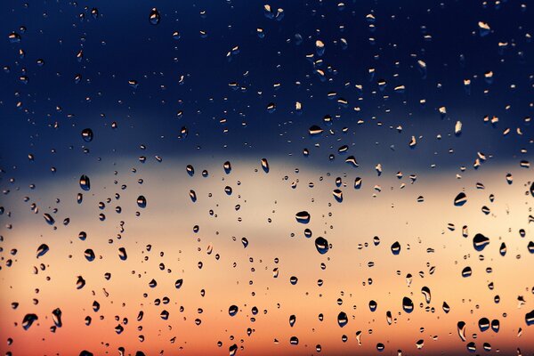 Raindrops running down the glass