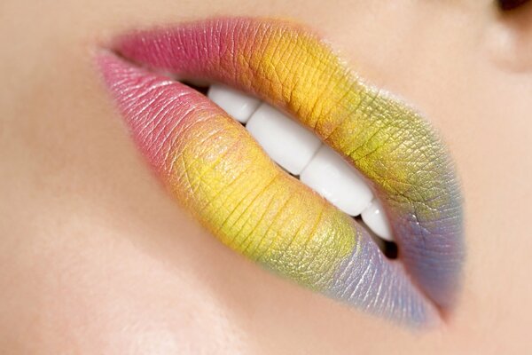 Coloridos labios brillantes del arco iris