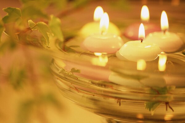 Candles in the water are light and warm