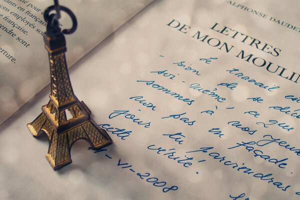 A letter from Paris a statuette of the Eiffel Tower