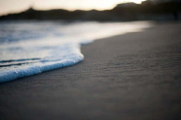 Sandy beach. Sea surf