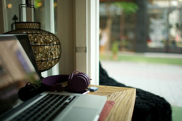 A laptop standing on the table in the room