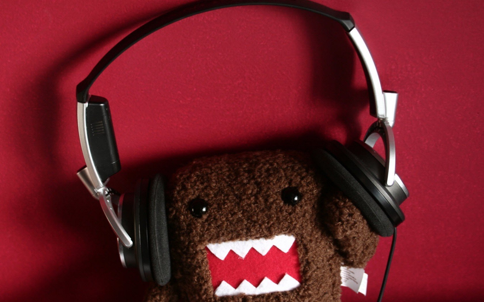 red background teddy monster headphone