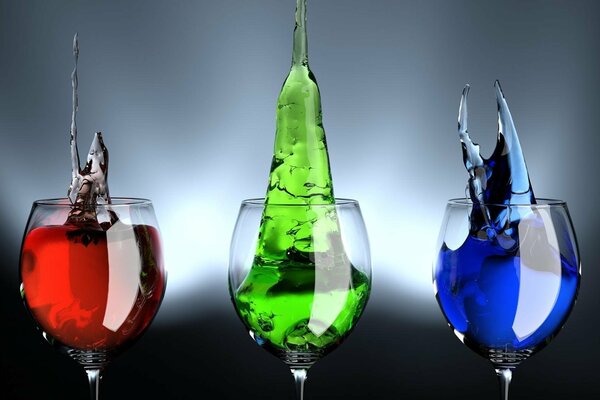 Multicolored liquid in glasses. Colour