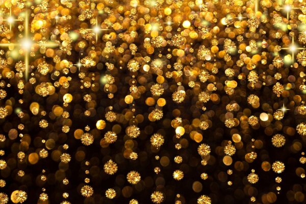 Beautiful picture. Gold sequins on a black background