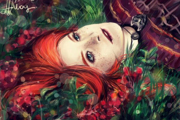 A red-haired girl is lying on the grass