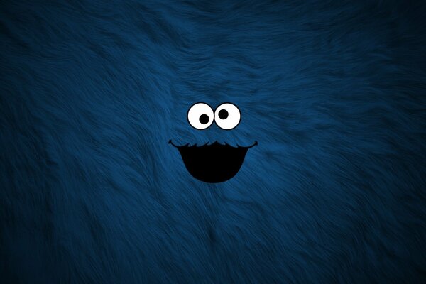 Cute blue monster on a furry background