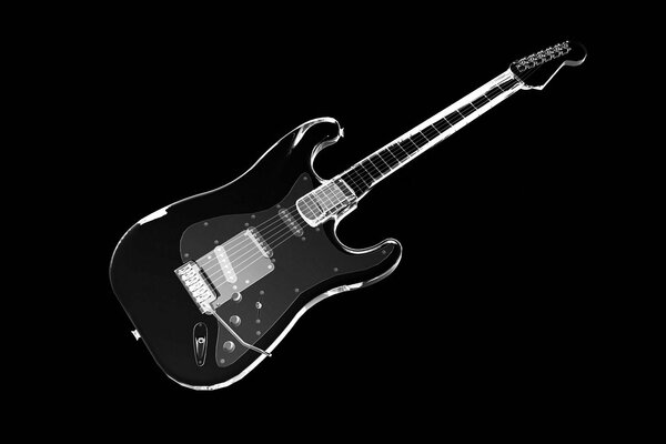 Elegante schwarze Gitarre auf schwarzem Hintergrund