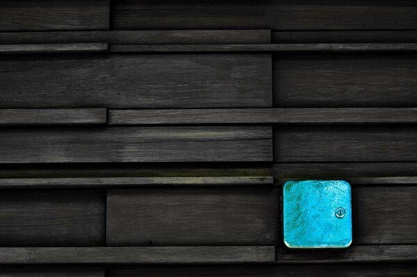 Blue box on dark wood