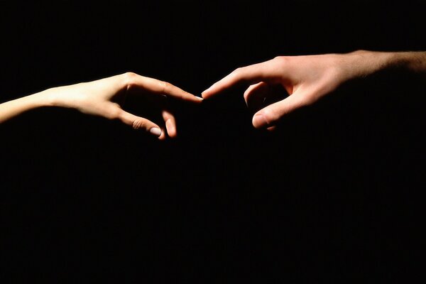 Stretching hands on a black background