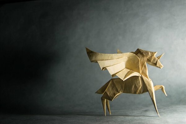 Origami of a white horse on a black background