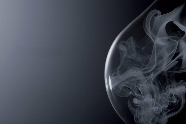 Smoke in a bubble on a black background